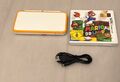 New Nintendo 2DS XL Weiss Orange Handheld Konsole + Ladekabel + Mario Spiel Top