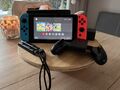 Nintendo Switch Konsole mit Joy-Con - Neon-Rot/Neon-Blau/Grau