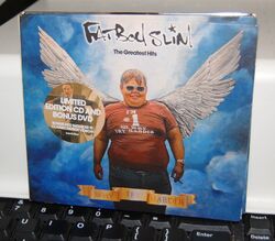 FATBOY SLIM.  "THE GREATEST HITS - WHY TRY HÄRDER"" CD + DVD." UK 2006. DIGIPAK. Neuwertig mit